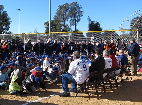 Former Dodgers Al Ferrara, Steve Yeager and Lee Lacy appeared genuinely appreciative as Dodgers broadcaster Charlie Steiner introduces them to the kids and parents on hand at Saturday's Dreamfield Dedication ceremony in Reseda.(Photo credit - Ron Cervenka