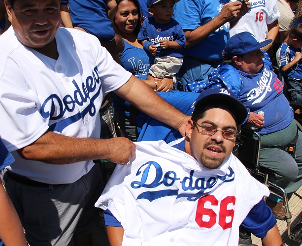 Puig gives a special Dodger fan the shirt off his back