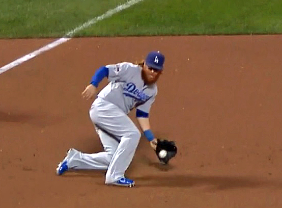 Turner's grab of this hot grounder brought an end to the seventh inning. Unfortunately, he aggravated his ailing left knee in the process. (Video capture courtesy of TBS. Click on image to view video)