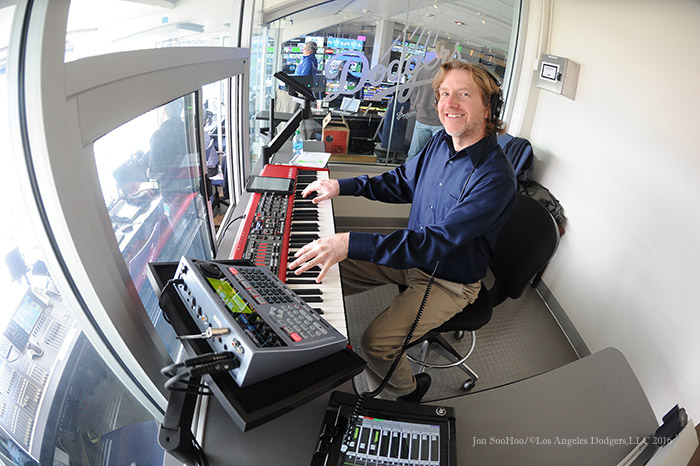 Dieter Ruehle at the keys of the Dodger Stadium organ for FanFest 2016 - headphones and all. (Photo credit - Jon SooHoo)