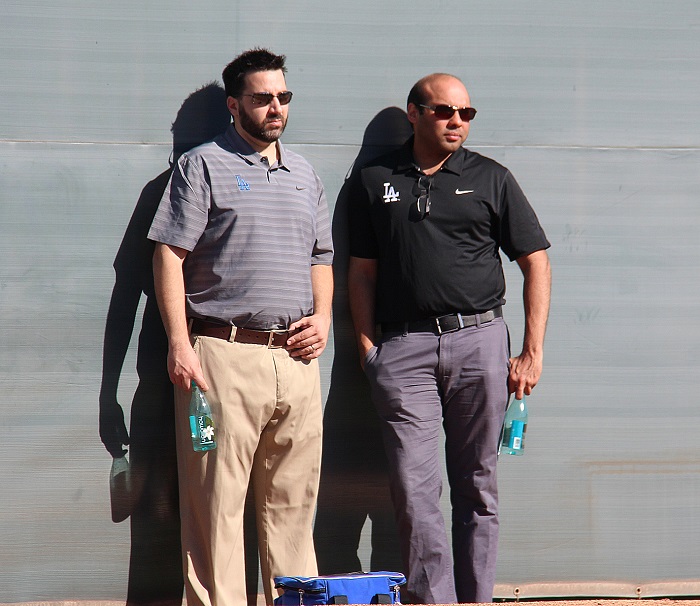Dodgers vice president of baseball operations Alex Anthopoulos and general manager Farhan Zaidi taking in a bullpen session during spring training. (Photo credit - Ron Cervenka)