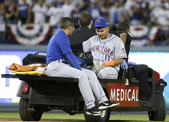 Mets shortstop Ruben Tejada is carted off the field after suffering a broken fibula from Chase Utley's takeout slide during Game-2 in the 2015 NLDS at Dodger Stadium. (Photo credit - Gregory Bull)
