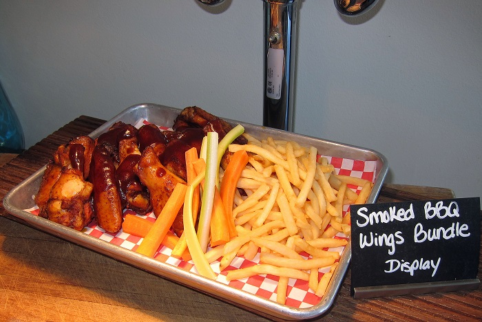 For those who prefer to get something for the entire family (of those who are incredibly hungry themselves), Chef Tingley has also created a Smoked BBQ Wings bundle that is outstanding. (Photo credit - Ron Cervenka)