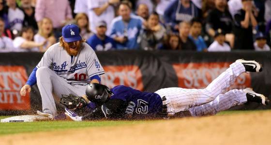 Dodgers third baseman Justin Turner tags out Trevor Story on Puig's unbelievable throw. (Photo courtesy of fxtribune.com)