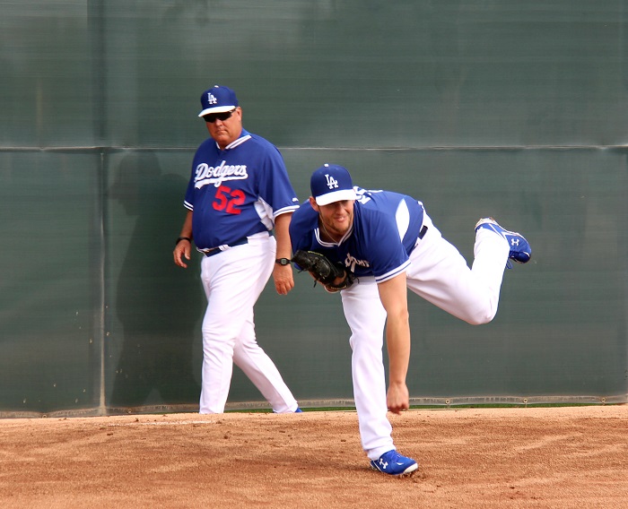 Dodgers minor league pitching co-ordinator Rick Knapp looks on as Clayton Kershaw throws a bullpen session during spring training. (Photo credit - Ron Cervenka)