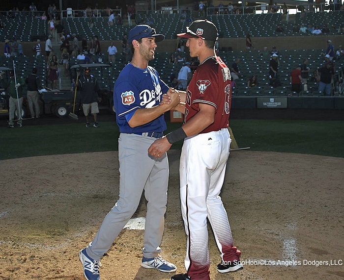 Brothers Michael and Nick Ahmed share a brotherly moment following the Dodgers-Dbacks spring training game on March 18, 2016. On this day Nick's team bested Michael's team by a score of 7-5. (Photo credit - Jon SooHoo)