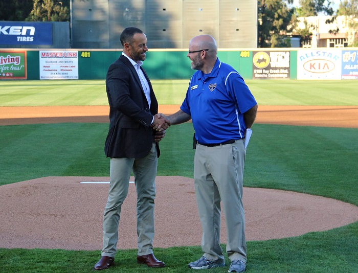 Dodgers director of player development Gabe Kapler and Quakes general manager Grant Riddle shake hands after finalizing the Dodgers Player Development Contract extension with the Rancho Cucamonga Quakes through the 2018 season. (Photo credit - Ron Cervenka)