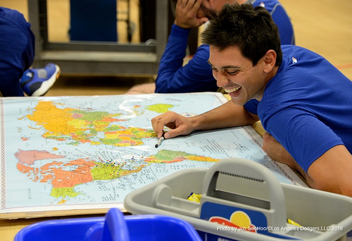 De Leon looks over his geography assignment prior to a spring training workout. (Photo credit - Jon SooHoo)