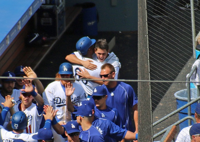 Jose De Leon and Yasiel Puig share a hug after Puig's third-inning three-run home run. (Photo credit - Ron Cervenka)