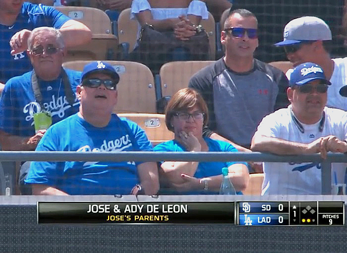 Jose M. and Ady De Leon look on as their son records his first career strikeout. (Video capture courtesy of SportsNet LA)