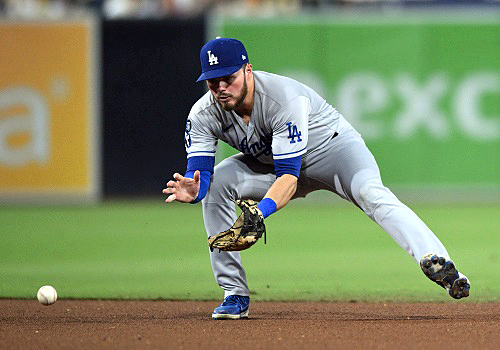 Los Angeles Dodgers shortstop Miguel Rojas is called on to pitch